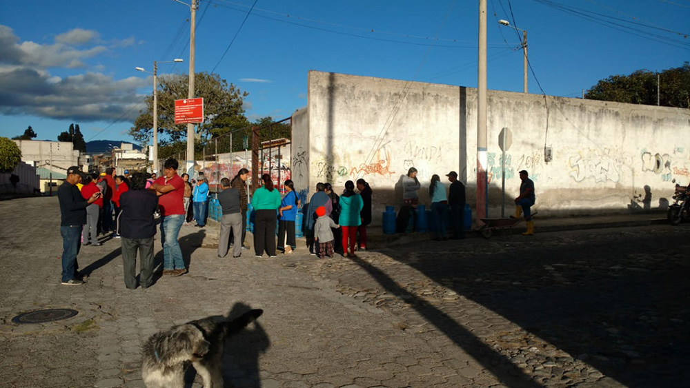 Cotacachi people waiting for gas in a line-up