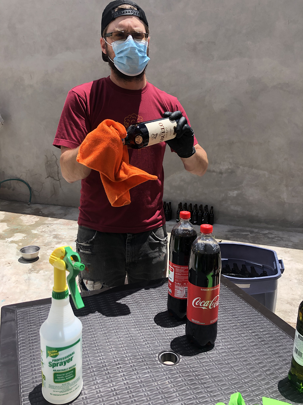 Roger sanitizing groceries at Hoppy Alpaca Hostel in Cotacachi.